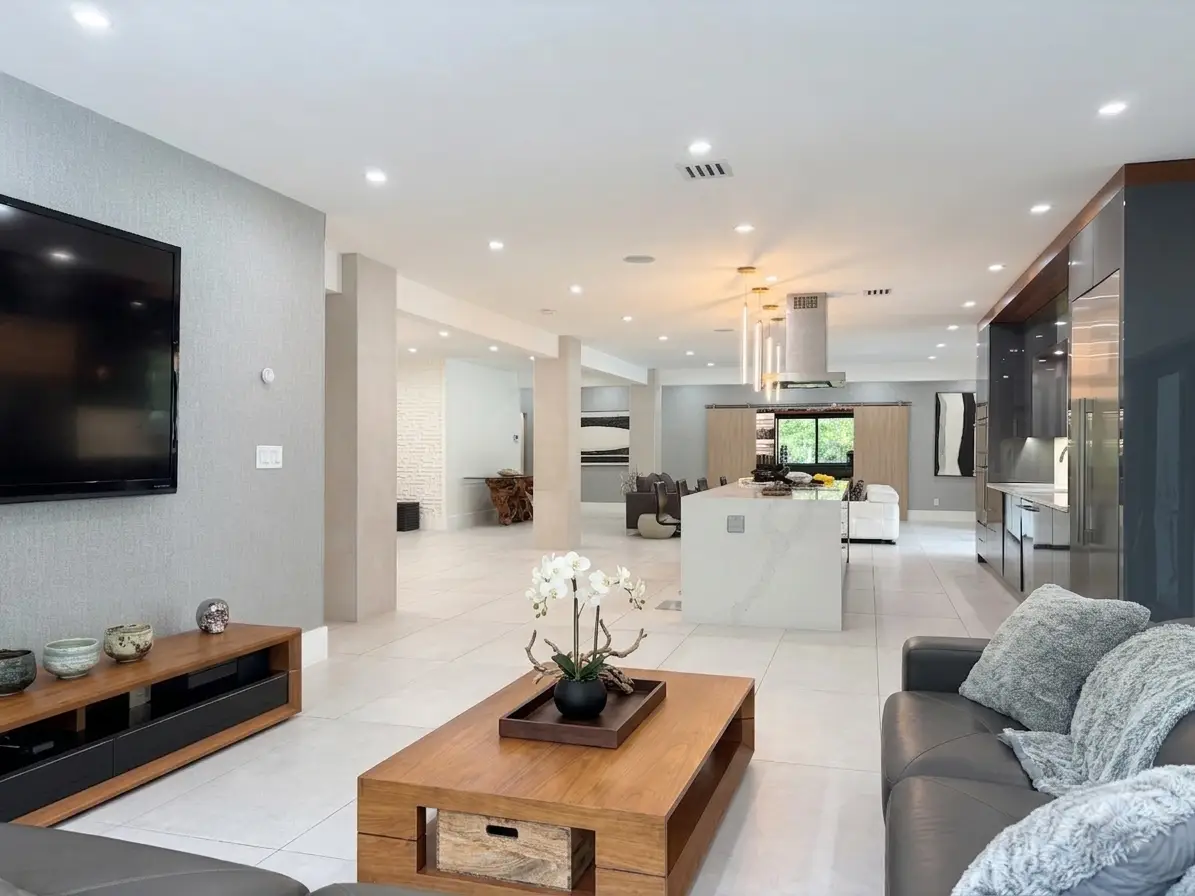 Family room at 14800 Marvin Lane, open floor plan with sliding glass doors to pool and garden