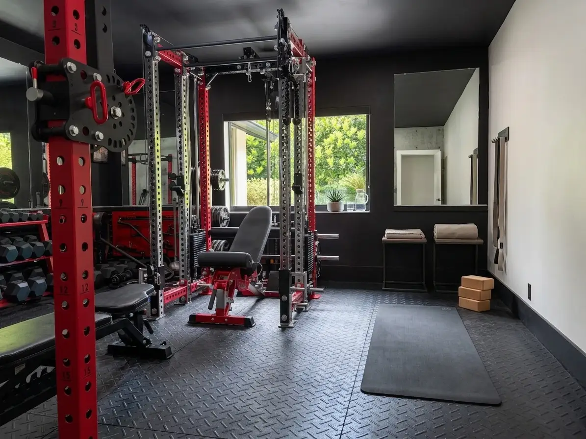 Fitness room with commercial equipment and mirrored wall
