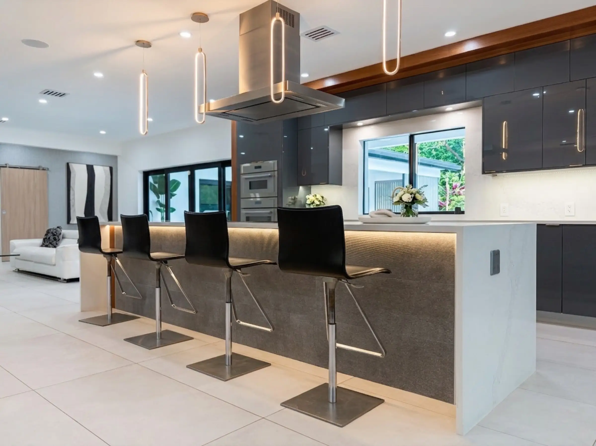 Kitchen with Thermador range and oversized waterfall island